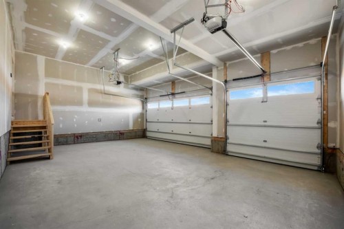 151 Dawson Wharf Mount, Chestermere, AB - Indoor Photo Showing Garage
