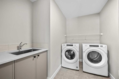 151 Dawson Wharf Mount, Chestermere, AB - Indoor Photo Showing Laundry Room