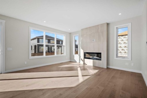 151 Dawson Wharf Mount, Chestermere, AB - Indoor Photo Showing Living Room With Fireplace
