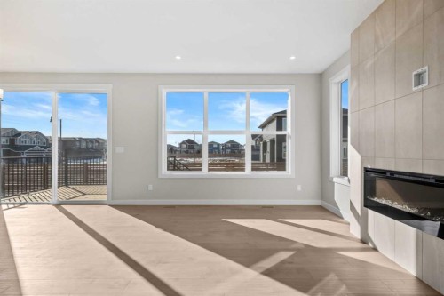 151 Dawson Wharf Mount, Chestermere, AB - Indoor Photo Showing Living Room With Fireplace