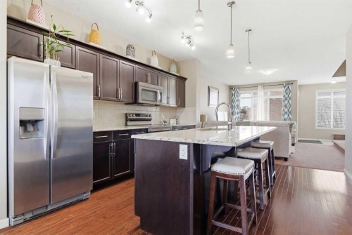 154 Cranford Park Se, Calgary, AB - Indoor Photo Showing Kitchen With Upgraded Kitchen
