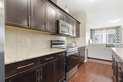 154 Cranford Park Se, Calgary, AB - Indoor Photo Showing Kitchen With Upgraded Kitchen