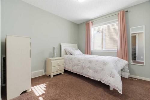 154 Cranford Park Se, Calgary, AB - Indoor Photo Showing Bedroom