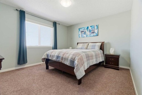 154 Cranford Park Se, Calgary, AB - Indoor Photo Showing Bedroom