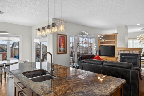 154 Sienna Ridge Landing Sw, Calgary, AB - Indoor Photo Showing Kitchen With Fireplace With Double Sink With Upgraded Kitchen