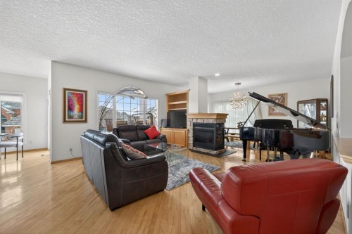 154 Sienna Ridge Landing Sw, Calgary, AB - Indoor Photo Showing Living Room With Fireplace
