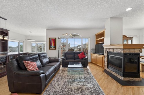 154 Sienna Ridge Landing Sw, Calgary, AB - Indoor Photo Showing Living Room With Fireplace