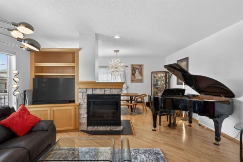154 Sienna Ridge Landing Sw, Calgary, AB - Indoor Photo Showing Living Room With Fireplace