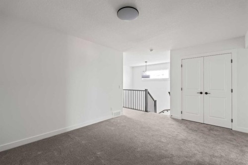 49 Starling Passage Nw, Calgary, AB - Indoor Photo Showing Other Room