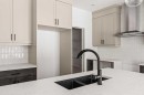 49 Starling Passage Nw, Calgary, AB  - Indoor Photo Showing Kitchen With Double Sink With Upgraded Kitchen 