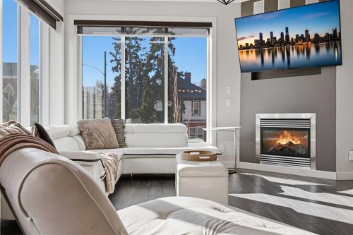 206-910 18 Avenue Sw, Calgary, AB - Indoor Photo Showing Living Room With Fireplace