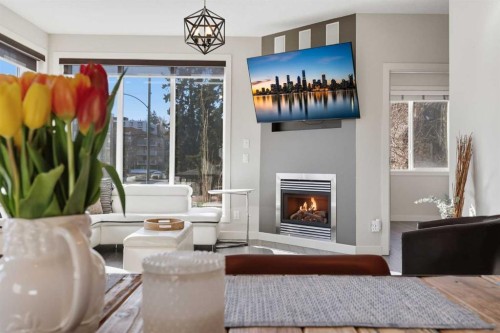 206-910 18 Avenue Sw, Calgary, AB - Indoor Photo Showing Other Room With Fireplace