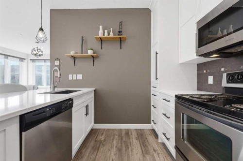 206-910 18 Avenue Sw, Calgary, AB - Indoor Photo Showing Kitchen With Stainless Steel Kitchen With Upgraded Kitchen