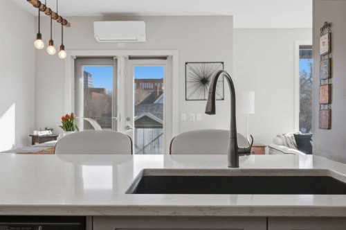 206-910 18 Avenue Sw, Calgary, AB - Indoor Photo Showing Kitchen With Double Sink