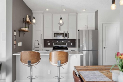 206-910 18 Avenue Sw, Calgary, AB - Indoor Photo Showing Kitchen With Stainless Steel Kitchen With Upgraded Kitchen