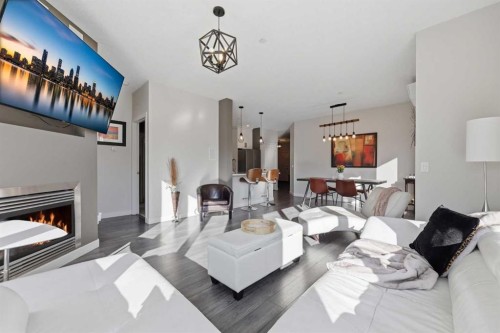 206-910 18 Avenue Sw, Calgary, AB - Indoor Photo Showing Living Room With Fireplace