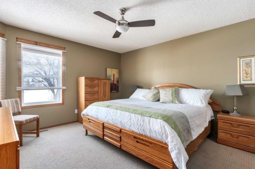 912 Riverside Drive Nw, High River, AB - Indoor Photo Showing Bedroom