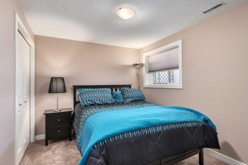 912 Riverside Drive Nw, High River, AB - Indoor Photo Showing Bedroom
