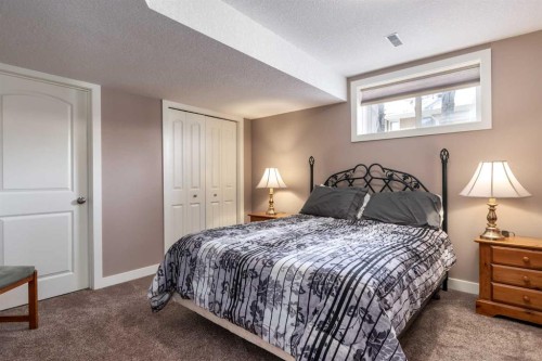 912 Riverside Drive Nw, High River, AB - Indoor Photo Showing Bedroom