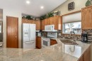 912 Riverside Drive Nw, High River, AB  - Indoor Photo Showing Kitchen With Double Sink 