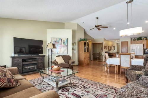 912 Riverside Drive Nw, High River, AB - Indoor Photo Showing Living Room With Fireplace