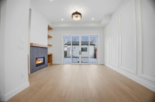 806 23 Avenue Se, Calgary, AB - Indoor Photo Showing Other Room With Fireplace