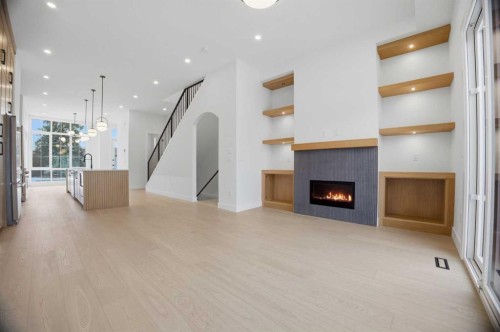 806 23 Avenue Se, Calgary, AB - Indoor Photo Showing Other Room With Fireplace