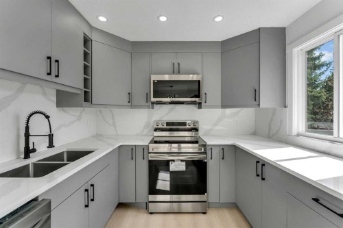62 Deer Ridge Way Se, Calgary, AB - Indoor Photo Showing Kitchen With Double Sink With Upgraded Kitchen