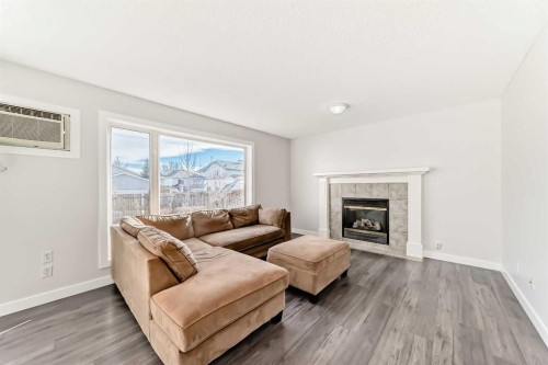 57 Cimarron Meadows Crescent, Okotoks, AB - Indoor Photo Showing Living Room With Fireplace