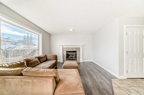 57 Cimarron Meadows Crescent, Okotoks, AB - Indoor Photo Showing Living Room With Fireplace