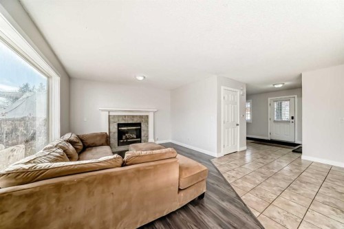 57 Cimarron Meadows Crescent, Okotoks, AB - Indoor Photo Showing Living Room With Fireplace