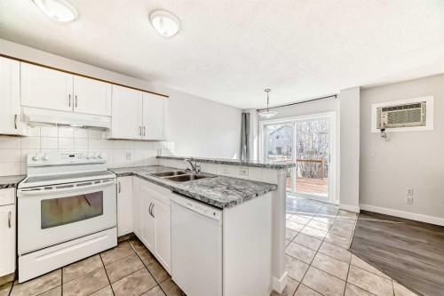57 Cimarron Meadows Crescent, Okotoks, AB - Indoor Photo Showing Kitchen With Double Sink