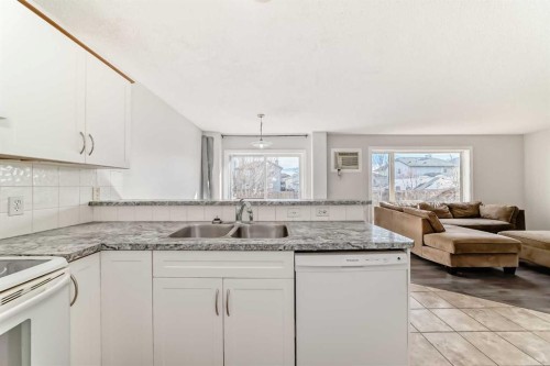 57 Cimarron Meadows Crescent, Okotoks, AB - Indoor Photo Showing Kitchen With Double Sink