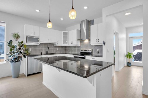 76 Edith Mews Nw, Calgary, AB - Indoor Photo Showing Kitchen With Stainless Steel Kitchen With Upgraded Kitchen