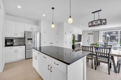 76 Edith Mews Nw, Calgary, AB - Indoor Photo Showing Kitchen With Stainless Steel Kitchen With Upgraded Kitchen