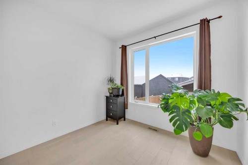 76 Edith Mews Nw, Calgary, AB - Indoor Photo Showing Bedroom