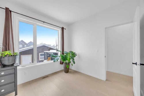 76 Edith Mews Nw, Calgary, AB - Indoor Photo Showing Other Room