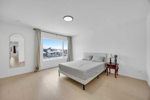 76 Edith Mews Nw, Calgary, AB - Indoor Photo Showing Bedroom
