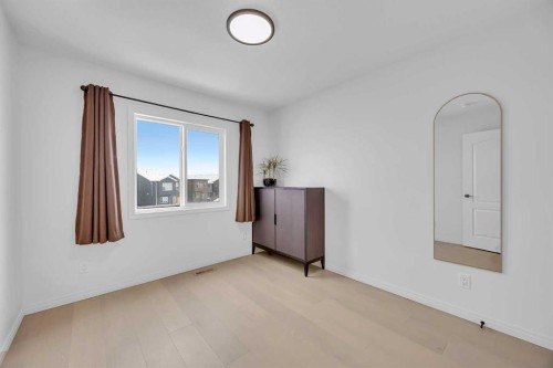 76 Edith Mews Nw, Calgary, AB - Indoor Photo Showing Other Room