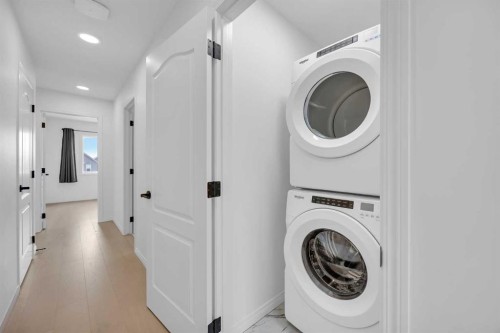 76 Edith Mews Nw, Calgary, AB - Indoor Photo Showing Laundry Room
