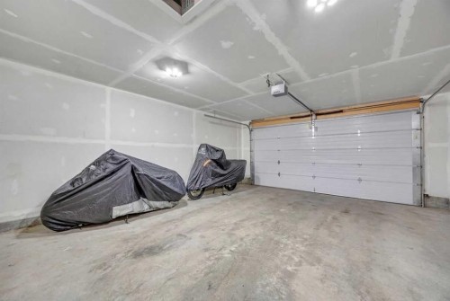 76 Edith Mews Nw, Calgary, AB - Indoor Photo Showing Garage