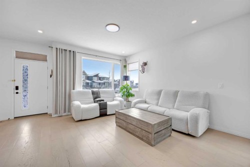 76 Edith Mews Nw, Calgary, AB - Indoor Photo Showing Living Room