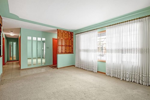 47 Montrose Crescent Ne, Calgary, AB - Indoor Photo Showing Other Room