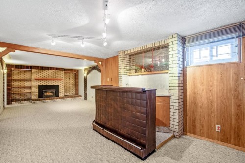 47 Montrose Crescent Ne, Calgary, AB - Indoor With Fireplace