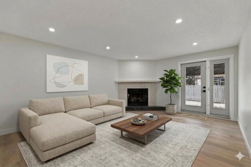 2031 24 Avenue Ne, Calgary, AB - Indoor Photo Showing Living Room With Fireplace