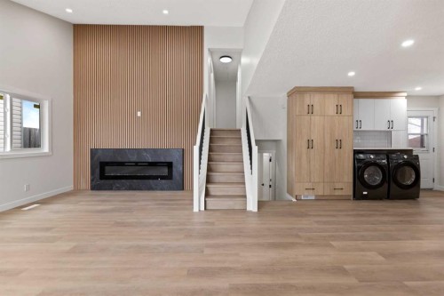 2031 24 Avenue Ne, Calgary, AB - Indoor Photo Showing Other Room With Fireplace