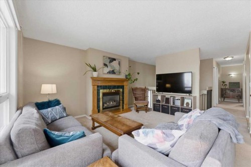 165 Macewan Glen Drive Nw, Calgary, AB - Indoor Photo Showing Living Room With Fireplace
