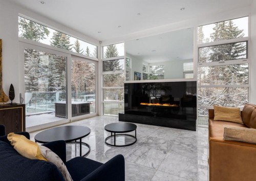 106 Pumpridge Place Sw, Calgary, AB - Indoor Photo Showing Living Room With Fireplace