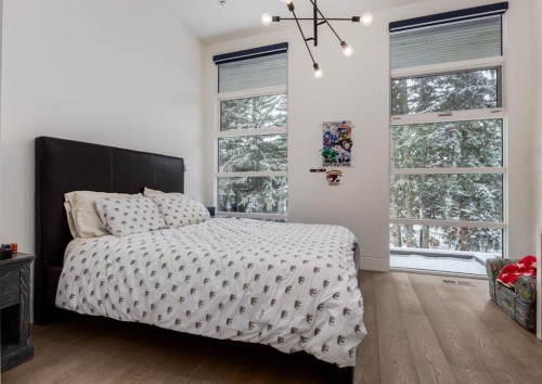 106 Pumpridge Place Sw, Calgary, AB - Indoor Photo Showing Bedroom