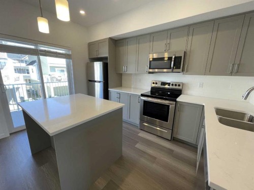 505 Copperstone Manor Se, Calgary, AB - Indoor Photo Showing Kitchen With Stainless Steel Kitchen With Double Sink